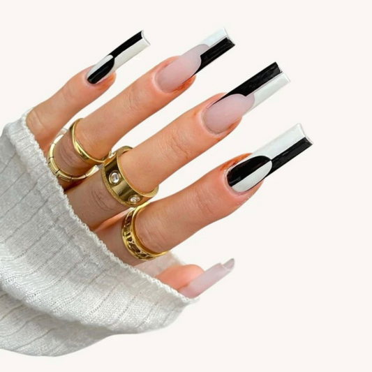 false press on nails that are black and white with a checkerboard design in a long coffin shape 