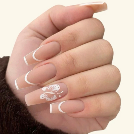 long coffin nude false press on nails with a french tip and white butterfly design