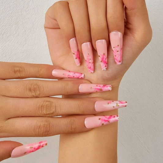 long coffin pink press on nails with white airbrush design and gold foil flecks