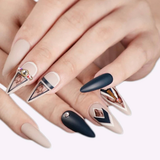 black and nude almond shaped press on nails with a marble design and unique gems
